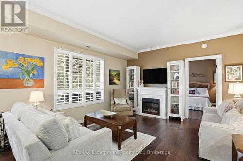 310 - 5188 Lakeshore Road, Burlington (Appleby), ON - Indoor Photo Showing Living Room With Fireplace