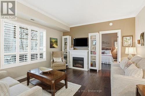 310 - 5188 Lakeshore Road, Burlington (Appleby), ON - Indoor Photo Showing Living Room With Fireplace