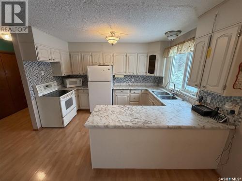 120 6Th Street E, Ponteix, SK - Indoor Photo Showing Kitchen With Double Sink