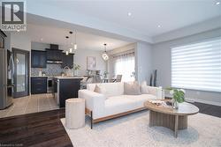 Living area with recessed lighting and wood finished floors - 