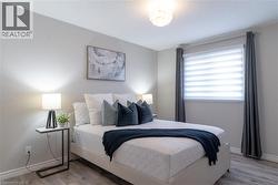 Bedroom featuring light wood finished floors - 