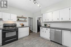 Bright kitchen with gas stove. - 