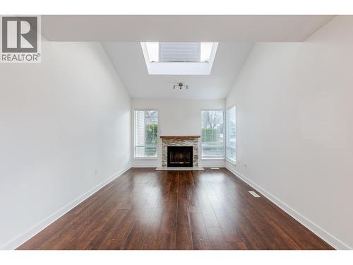 8008 Ash Street, Richmond, BC - Indoor Photo Showing Living Room With Fireplace