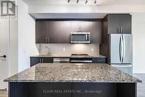 414 - 345 Wheat Boom Drive, Oakville, ON - Indoor Photo Showing Kitchen With Upgraded Kitchen