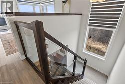 Staircase featuring wood finished floors and baseboards - 