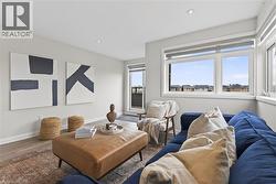 Living room featuring wood finished floors and recessed lighting - 