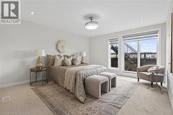 Carpeted bedroom with baseboards and recessed lighting - 