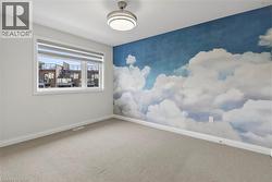 Spare room with baseboards and carpet - 