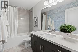 Full bathroom with shower / bath combination with curtain and vanity - 