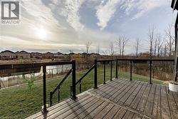 Deck featuring a residential view and a fenced backyard - 