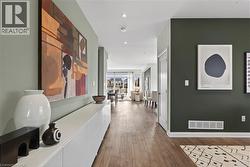 Hallway featuring dark wood-type flooring and recessed lighting - 