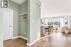 Mudroom featuring light wood-type flooring and baseboards - 