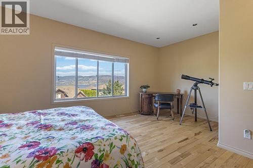 Views from primary bedroom - 610 Arrowleaf Lane, Kelowna, BC - Indoor Photo Showing Bedroom
