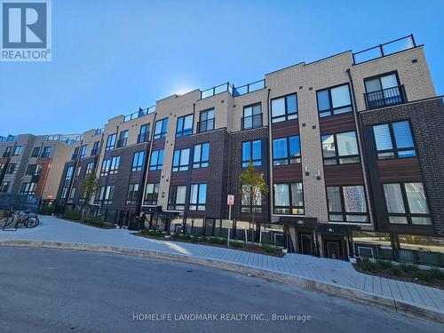 #5 - 155 Tapscott Road, Toronto, ON - Outdoor With Facade