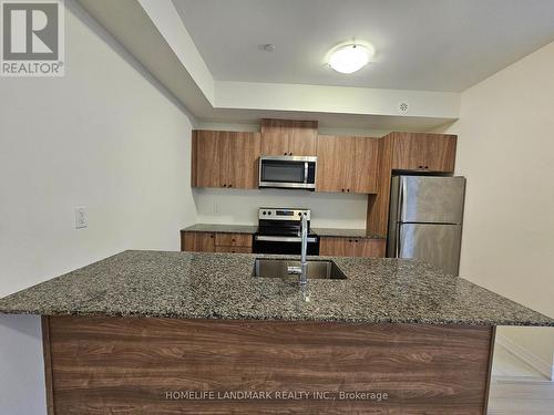 #5 - 155 Tapscott Road, Toronto, ON - Indoor Photo Showing Kitchen With Stainless Steel Kitchen