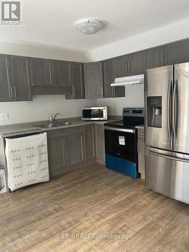 20 - 7945 Oldfield Road, Niagara Falls, ON - Indoor Photo Showing Kitchen With Stainless Steel Kitchen With Double Sink