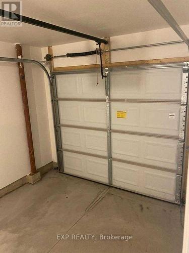 20 - 7945 Oldfield Road, Niagara Falls, ON - Indoor Photo Showing Garage