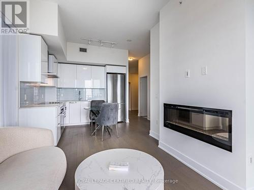 4701 - 20 Shore Breeze Drive, Toronto, ON - Indoor Photo Showing Living Room With Fireplace