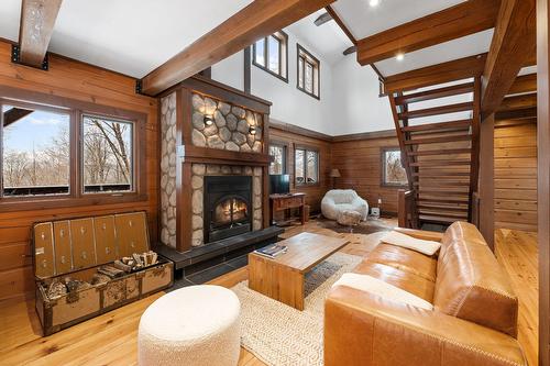 Salon - 515  - 517 Crois. De La Coulée, Lac-Supérieur, QC - Indoor Photo Showing Living Room With Fireplace