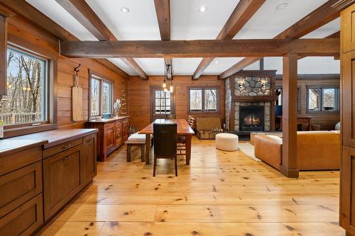 Cuisine - 515  - 517 Crois. De La Coulée, Lac-Supérieur, QC - Indoor With Fireplace