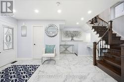 Main Entrance. Powder room. Access to Garage - 