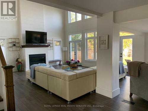 4 Crescent Road, Strong, ON - Indoor Photo Showing Living Room With Fireplace