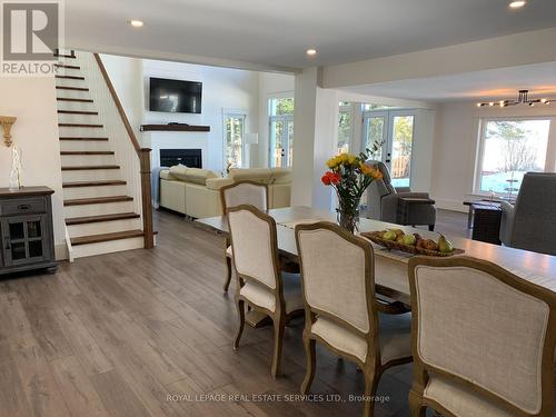 4 Crescent Road, Strong, ON - Indoor Photo Showing Dining Room With Fireplace
