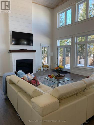 4 Crescent Road, Strong, ON - Indoor Photo Showing Living Room With Fireplace