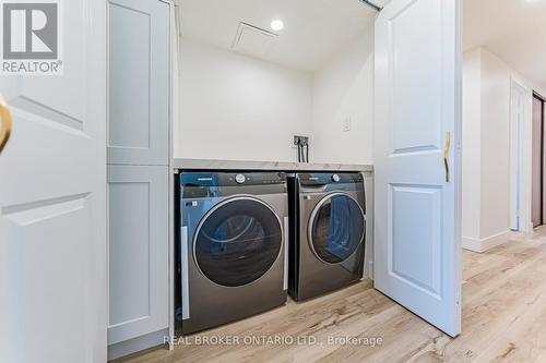 Laundry w/ Clothes-folding Counter - 1503 - 3131 Bridletowne Circle, Toronto, ON - Indoor Photo Showing Laundry Room