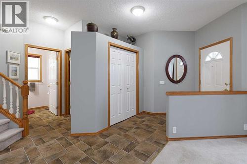 Greet family and friends in the spacious entry - 247 Mt Selkirk Close Se, Calgary, AB - Indoor Photo Showing Other Room
