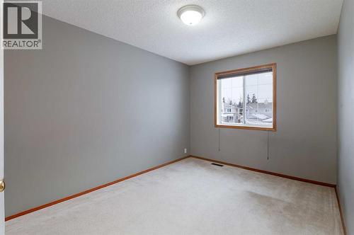 Family bedrooms are large enough to grow with your kids - 247 Mt Selkirk Close Se, Calgary, AB - Indoor Photo Showing Other Room