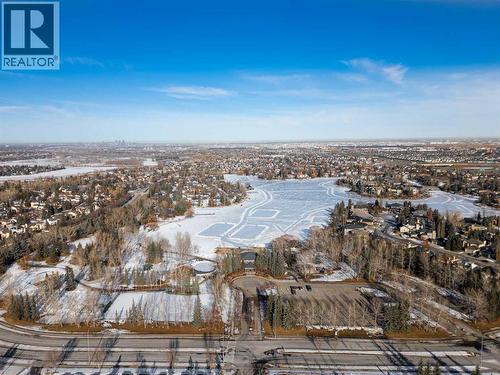 Skating at the lake in the winter. Fun for all ages. Imaging swimming and boating in the summer. Wow! - 247 Mt Selkirk Close Se, Calgary, AB - Outdoor With View
