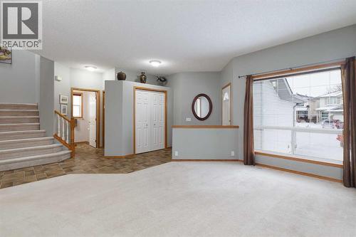 Your living room is perfect for entertaining - 247 Mt Selkirk Close Se, Calgary, AB - Indoor Photo Showing Other Room