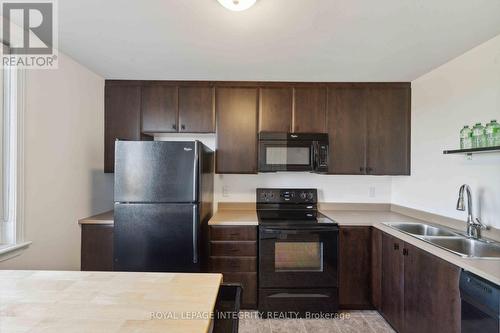 230 Shanly Private, Ottawa, ON - Indoor Photo Showing Kitchen With Double Sink