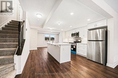 Dining room at the back of the photo - 2426 Watercolours Way, Ottawa, ON - Indoor Photo Showing Kitchen With Upgraded Kitchen