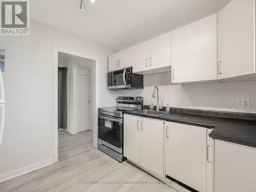 Upper - 708 Carnegie Avenue N, Oshawa, ON - Indoor Photo Showing Kitchen With Double Sink