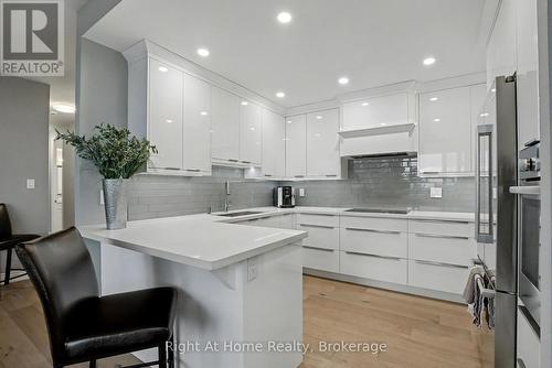 Breakfast Bar - 603 - 2121 Lakeshore Road, Burlington (Brant), ON - Indoor Photo Showing Kitchen With Upgraded Kitchen