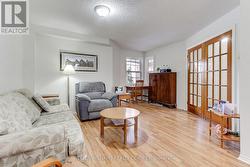 Living Room W/French Doors and Laminate Floors - 