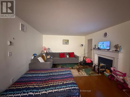 Upper - 12 Osgoode Street, Cambridge, ON - Indoor Photo Showing Living Room With Fireplace