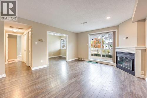 1520 Venetian Boulevard Unit# M108, Point Edward, ON - Indoor Photo Showing Living Room With Fireplace