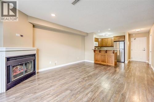 1520 Venetian Boulevard Unit# M108, Point Edward, ON - Indoor With Fireplace