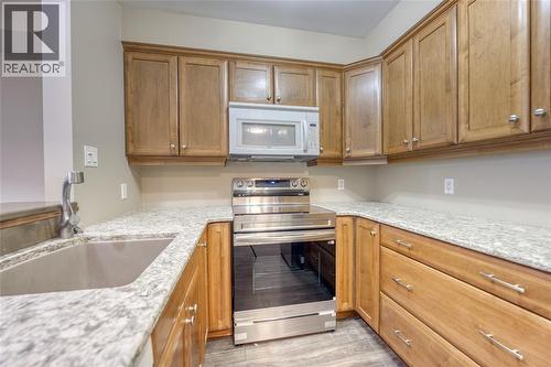 1520 Venetian Boulevard Unit# M108, Point Edward, ON - Indoor Photo Showing Kitchen