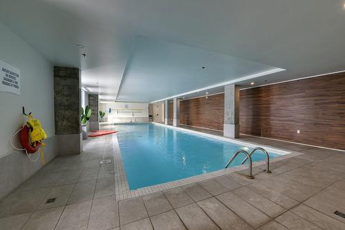 Pool - 401-2335 Rue Des Équinoxes, Montréal (Saint-Laurent), QC - Indoor Photo Showing Other Room With In Ground Pool