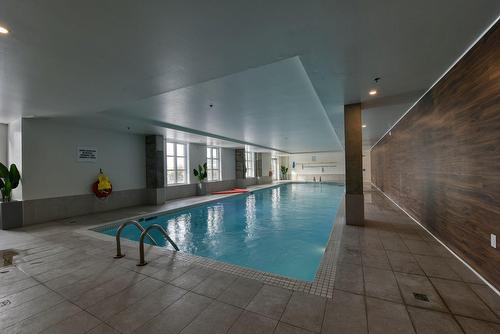 Pool - 401-2335 Rue Des Équinoxes, Montréal (Saint-Laurent), QC - Indoor Photo Showing Other Room With In Ground Pool