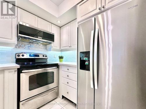 Stainless Steel Fridge, Microwave & Range - 521 - 15 Northtown Way, Toronto, ON - Indoor Photo Showing Kitchen With Stainless Steel Kitchen