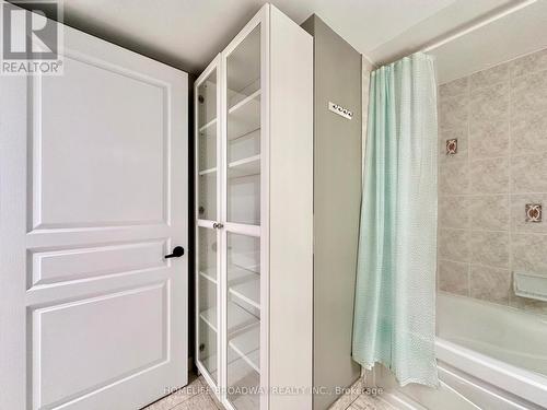White Glass Storage Cabinet Included with the sale - 521 - 15 Northtown Way, Toronto, ON - Indoor Photo Showing Bathroom