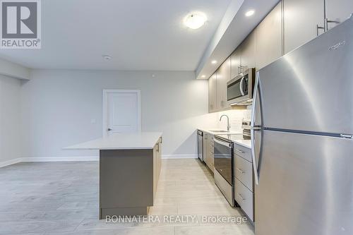 408 - 3200 William Coltson Avenue, Oakville, ON - Indoor Photo Showing Kitchen With Stainless Steel Kitchen