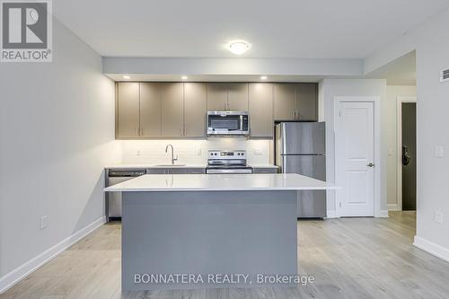 408 - 3200 William Coltson Avenue, Oakville, ON - Indoor Photo Showing Kitchen With Stainless Steel Kitchen With Upgraded Kitchen