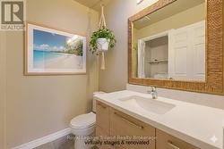 virtually staged & renovated 2pc bath & laundry - 