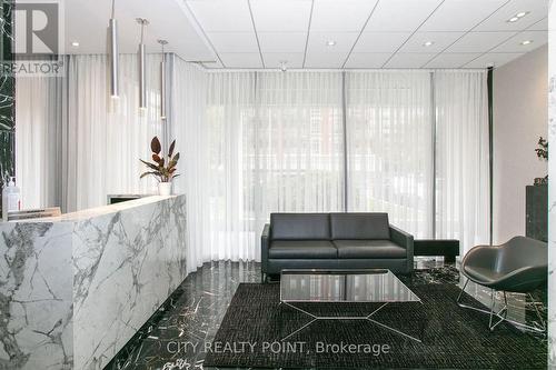 303 - 9 Deer Park Crescent, Toronto, ON - Indoor Photo Showing Living Room